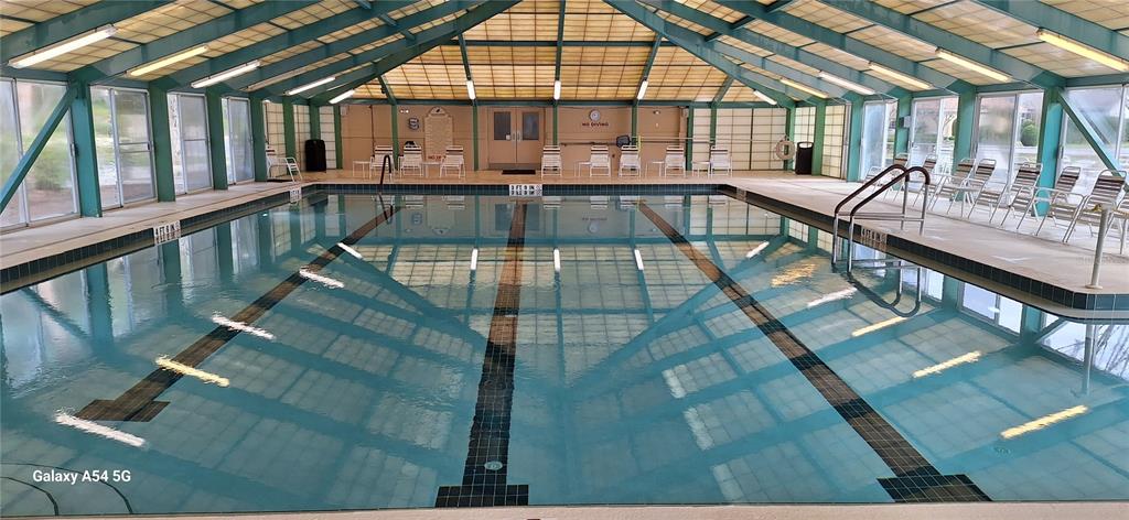 8534 Southwest 108th Pl Road Ocala, FL 34481 - Photo 35 of 41 a view of a swimming pool with seating area