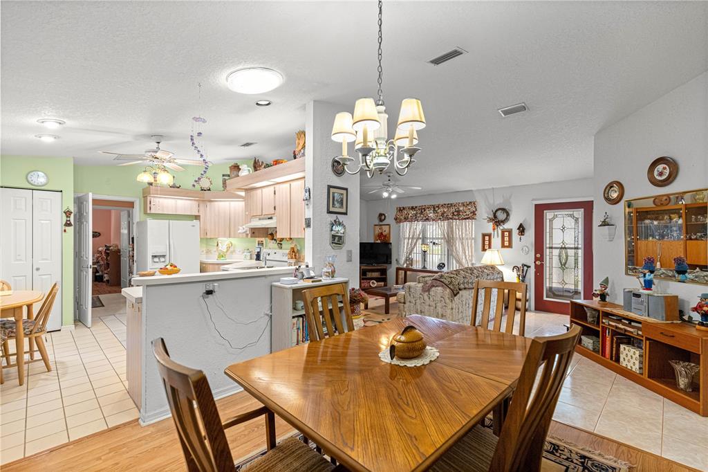 8534 Southwest 108th Pl Road Ocala, FL 34481 - Photo 8 of 41 a view of a dining table and chairs in a room