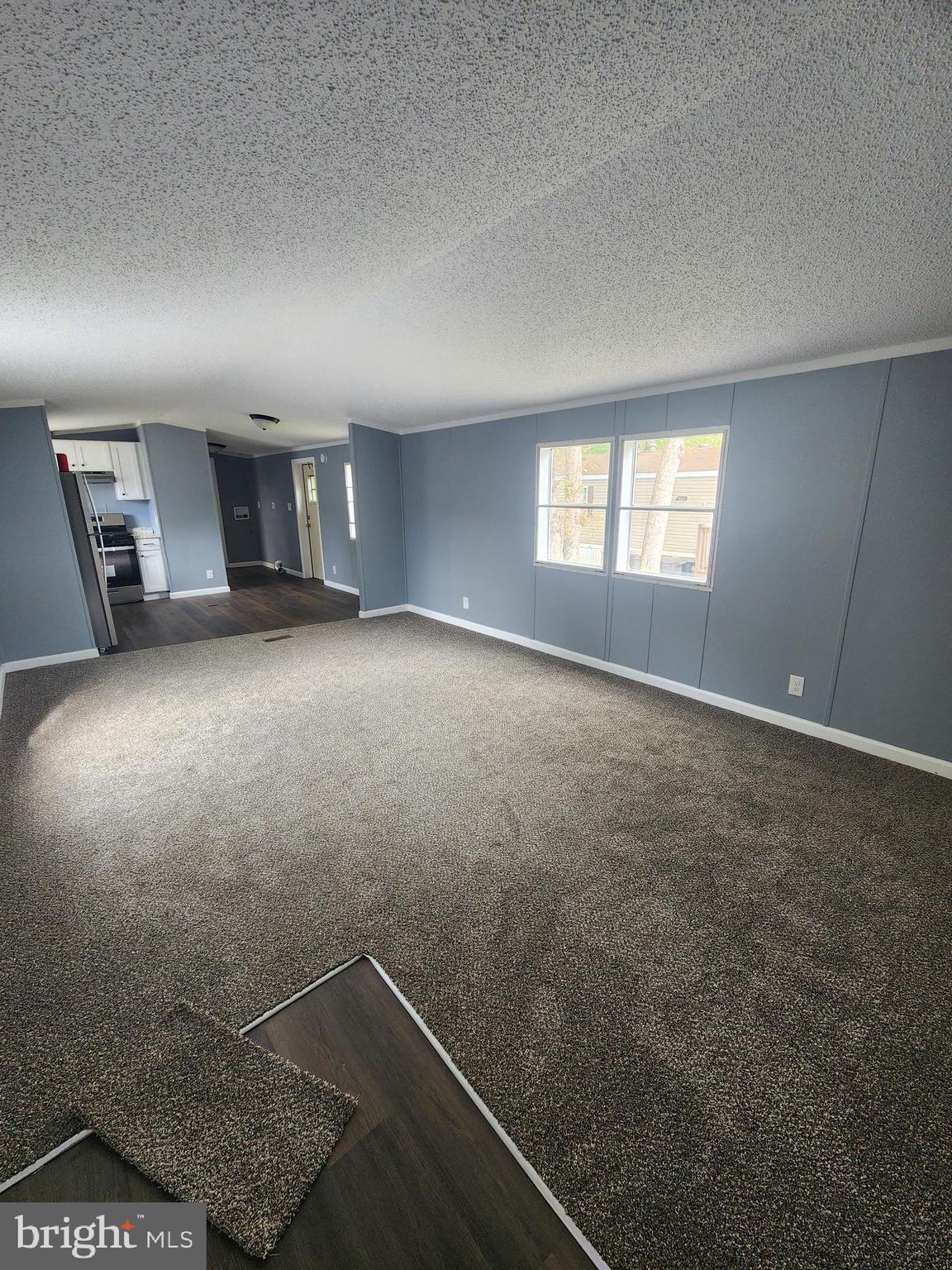 2110 Mays Landing Road, Unit 161 Millville, NJ 08332 - Photo 12 of 12 an empty room with windows and closet