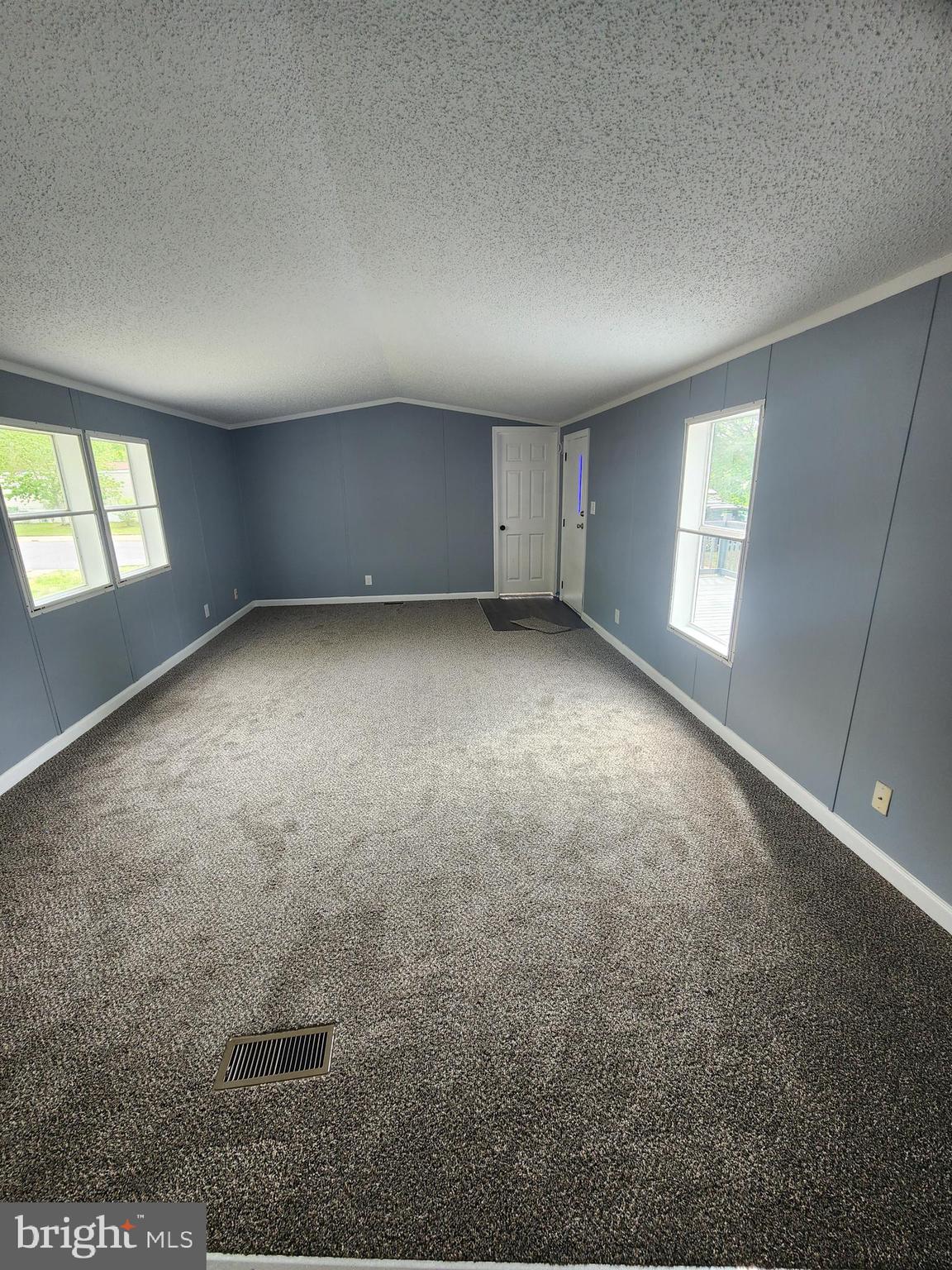 2110 Mays Landing Road, Unit 161 Millville, NJ 08332 - Photo 9 of 12 an empty room with windows