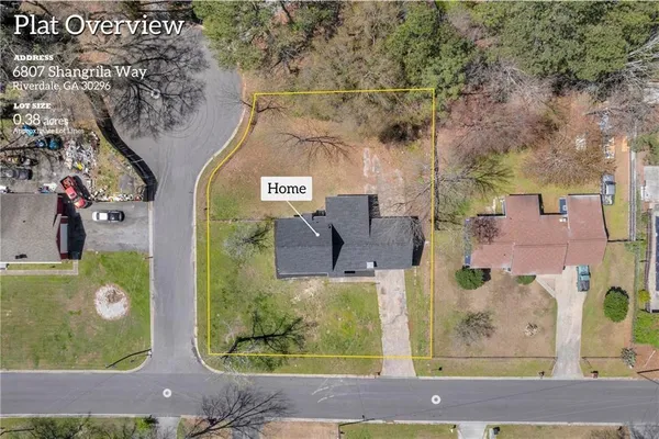 an aerial view of a house with yard