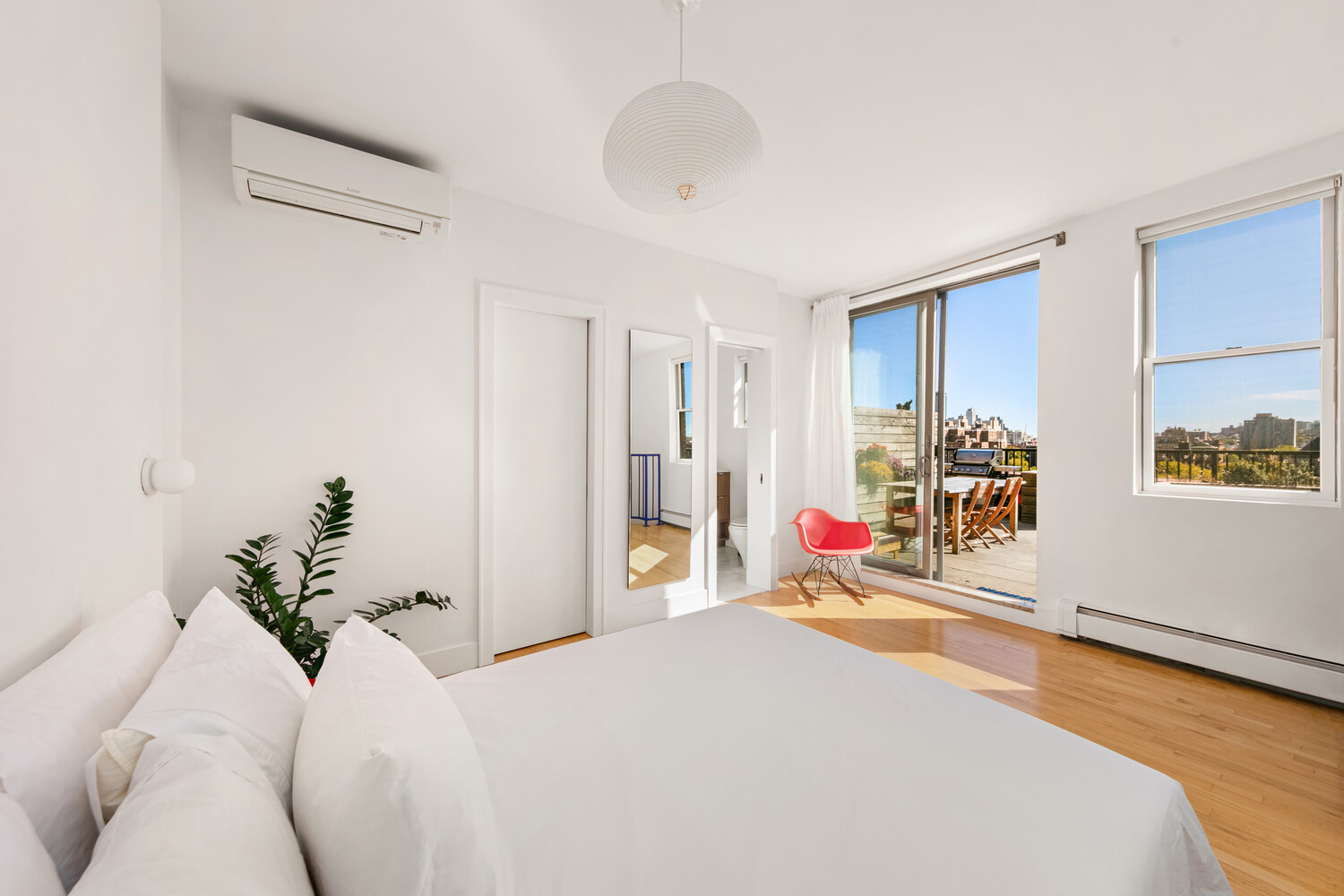 344 Degraw Street, Unit PHA Brooklyn, NY 11231 - Photo 7 of 14 a bedroom with a bed and a chandelier