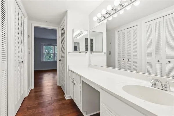 a en suite bathroom with a sink and mirror