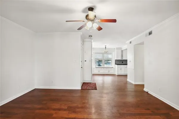 a view of kitchen with refrigerator and window