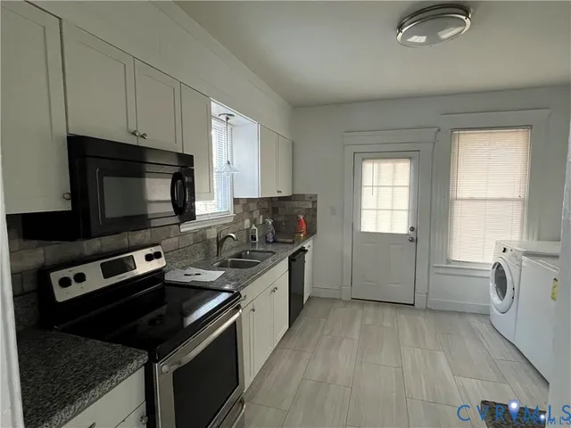 a kitchen with a stove and a microwave
