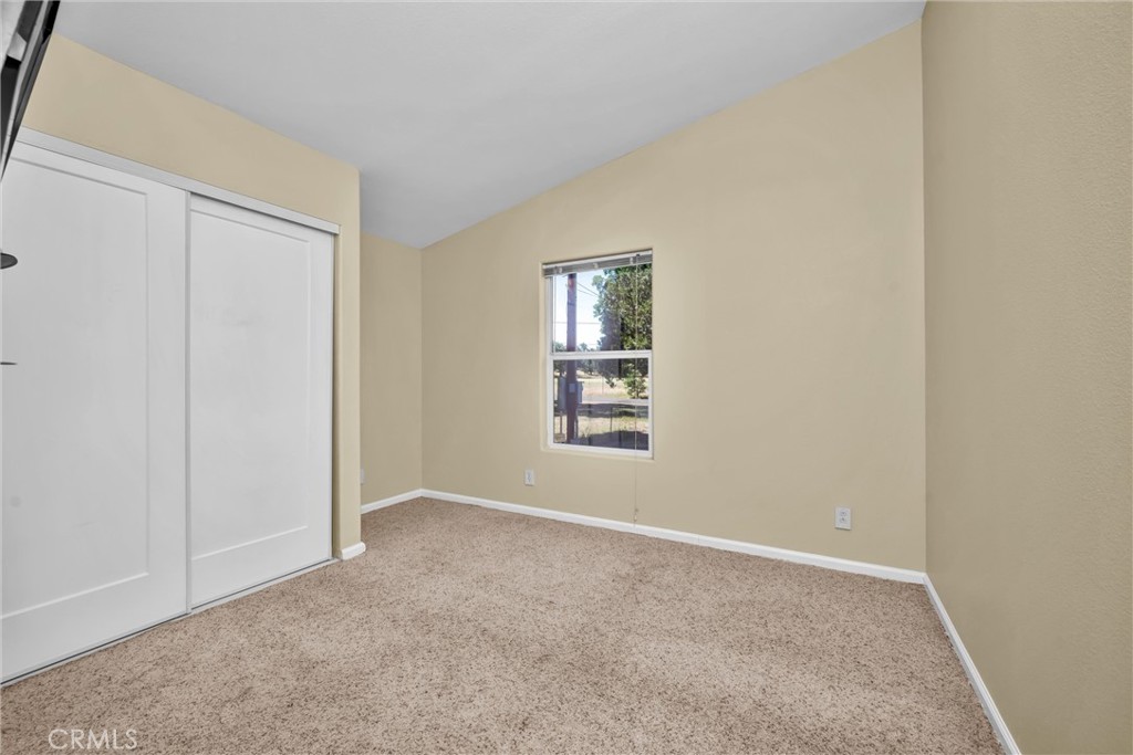16410 Tish-A-Tang Road Lower Lake, CA 95457 - Photo 19 of 48 an empty room with windows and closet