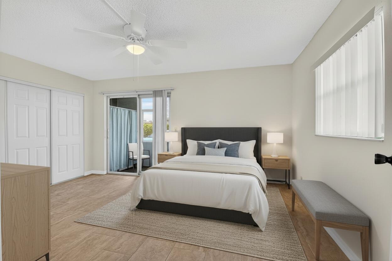 51 Flanders B Delray Beach, FL 33484 - Photo 11 of 36 a bedroom with a bed and a window