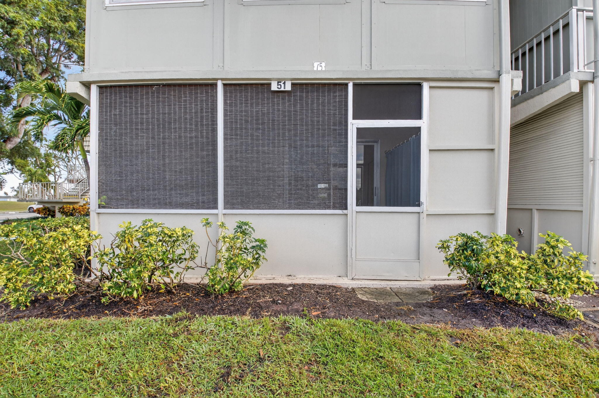 51 Flanders B Delray Beach, FL 33484 - Photo 21 of 36 a house with a yard and a stove