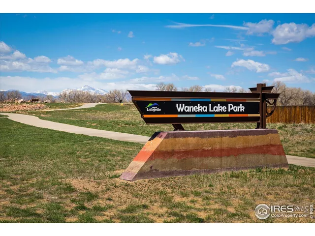 a view of a pool a fire pit and outdoor seating