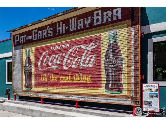 a view of a brick building with a tree in front of it