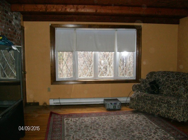 102 West Millbury Road Sutton, MA 01590 - Photo 11 of 24 a living room with furniture and a window