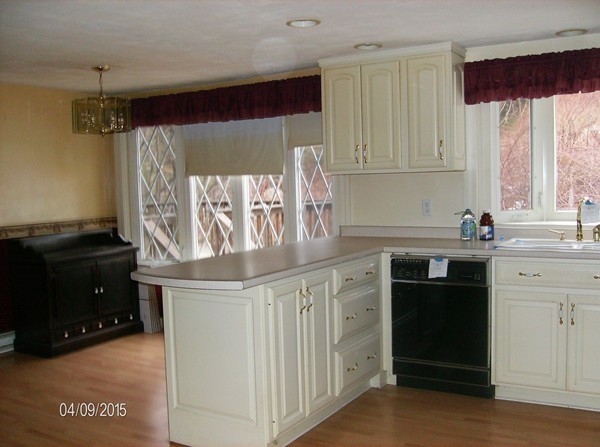102 West Millbury Road Sutton, MA 01590 - Photo 12 of 24 a kitchen with a stove and a refrigerator