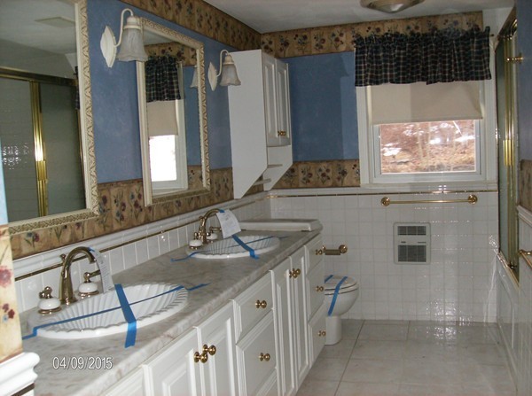102 West Millbury Road Sutton, MA 01590 - Photo 13 of 24 a bathroom with a double vanity sink and a mirror