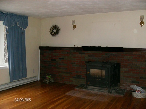 102 West Millbury Road Sutton, MA 01590 - Photo 14 of 24 a living room with a fireplace