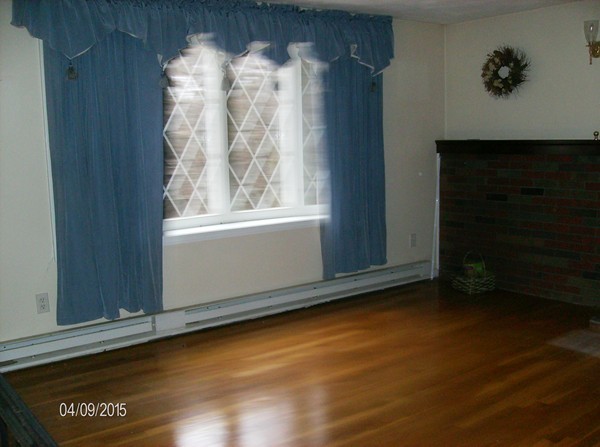 102 West Millbury Road Sutton, MA 01590 - Photo 15 of 24 a view of an empty room with wooden floor and a window