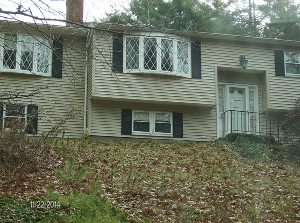 102 West Millbury Road Sutton, MA 01590 - Photo 3 of 24 a brick house with a large windows