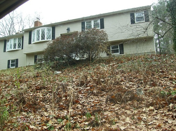 102 West Millbury Road Sutton, MA 01590 - Photo 7 of 24 a view of a house with a garden