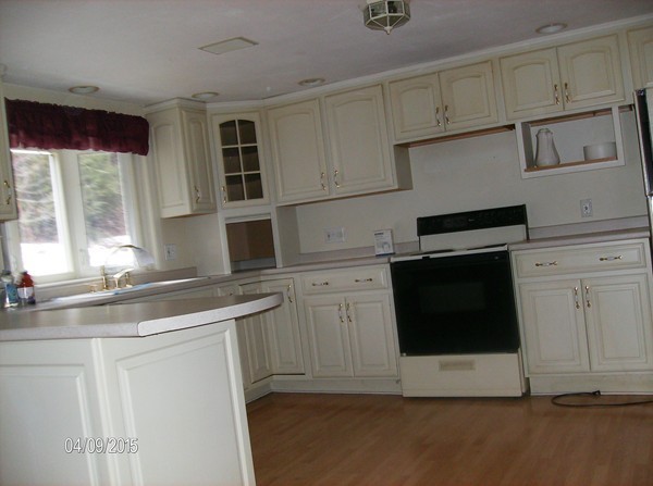 102 West Millbury Road Sutton, MA 01590 - Photo 9 of 24 a kitchen with stainless steel appliances white cabinets and a sink