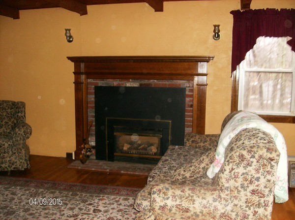 102 West Millbury Road Sutton, MA 01590 - Photo 10 of 24 a living room with a fireplace