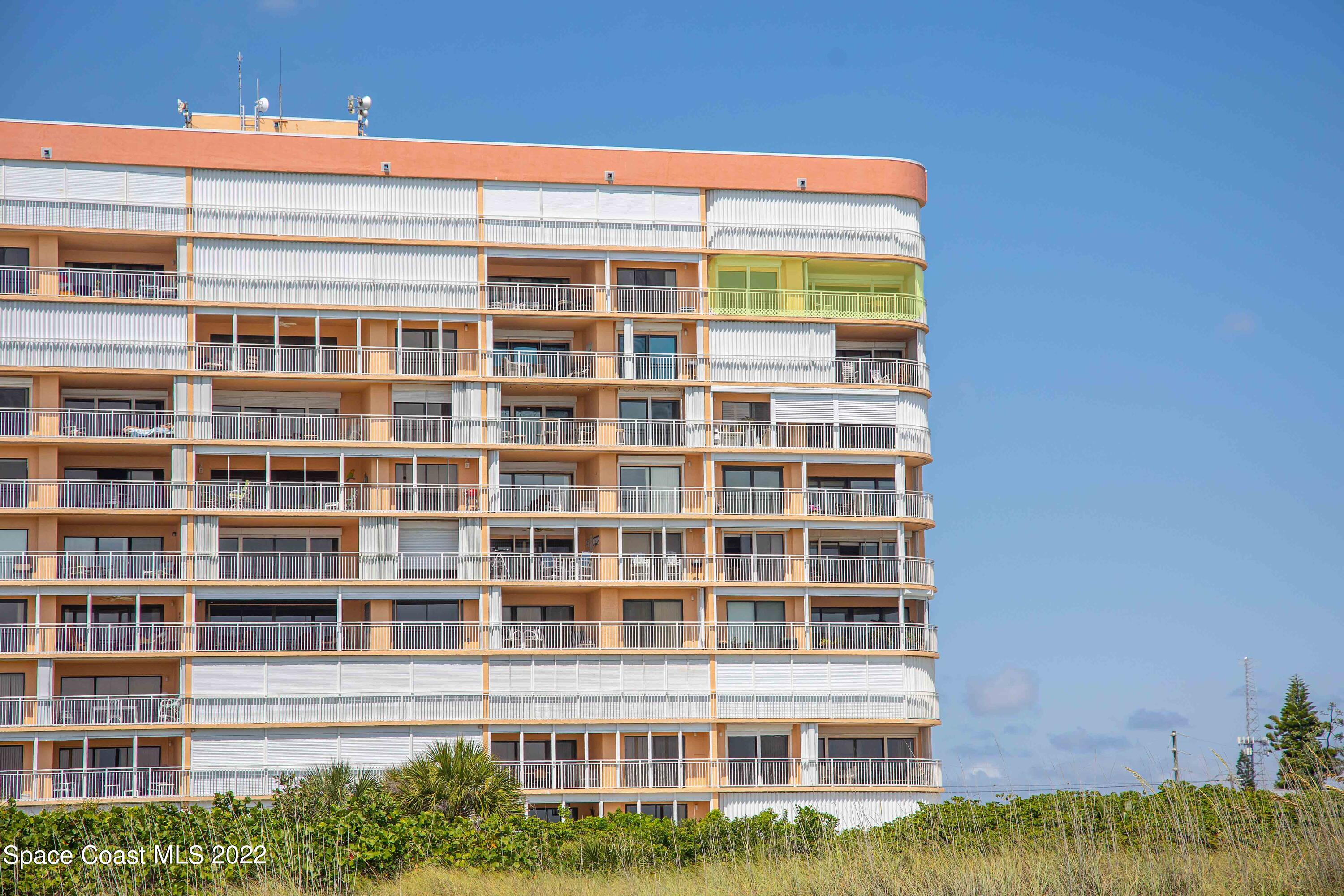 6770 Ridgewood Avenue, Unit 1001 Cocoa Beach, FL 32931 - Photo 2 of 57 a front view of a building
