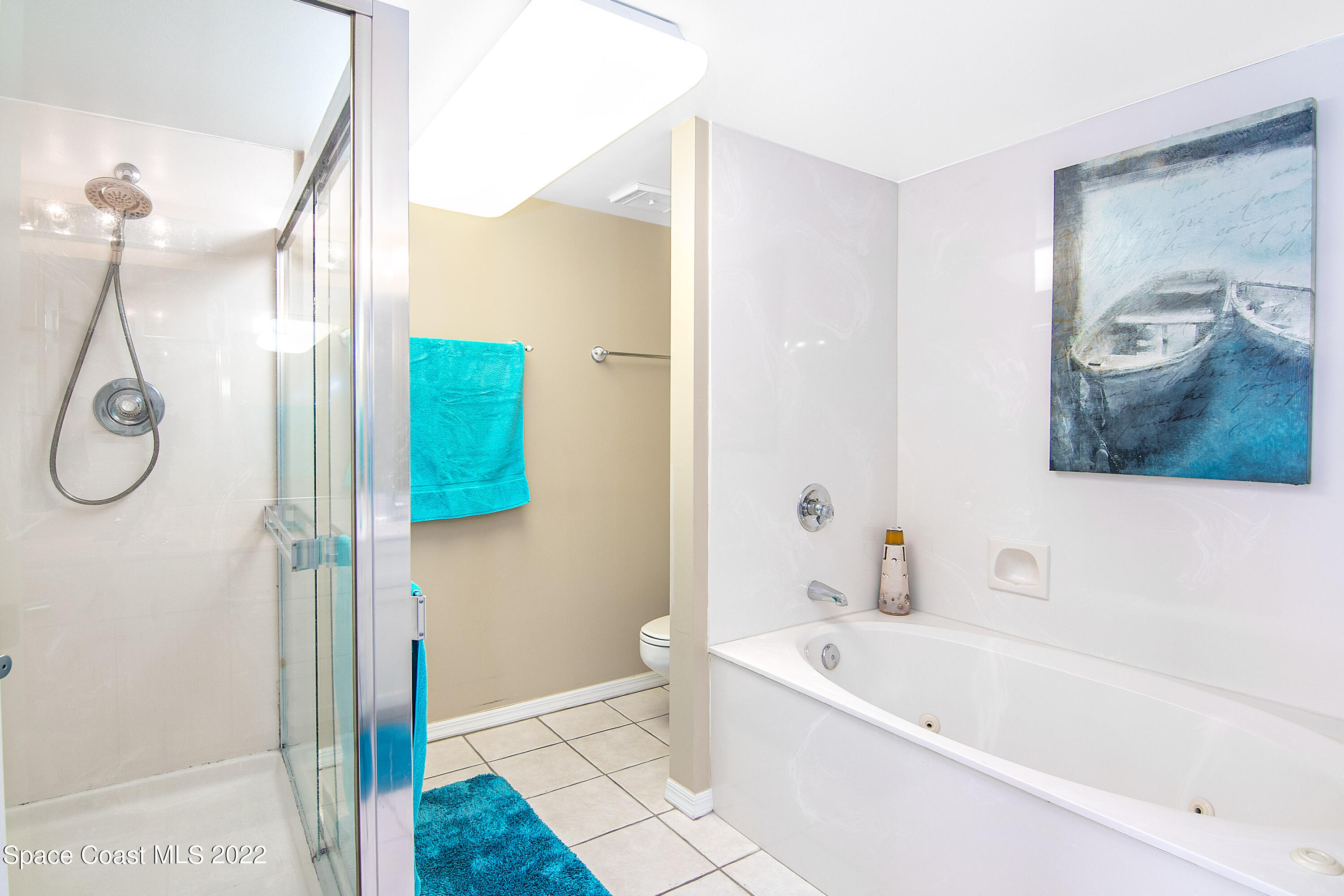 6770 Ridgewood Avenue, Unit 1001 Cocoa Beach, FL 32931 - Photo 28 of 57 a bathroom with a bathtub a shower and a sink