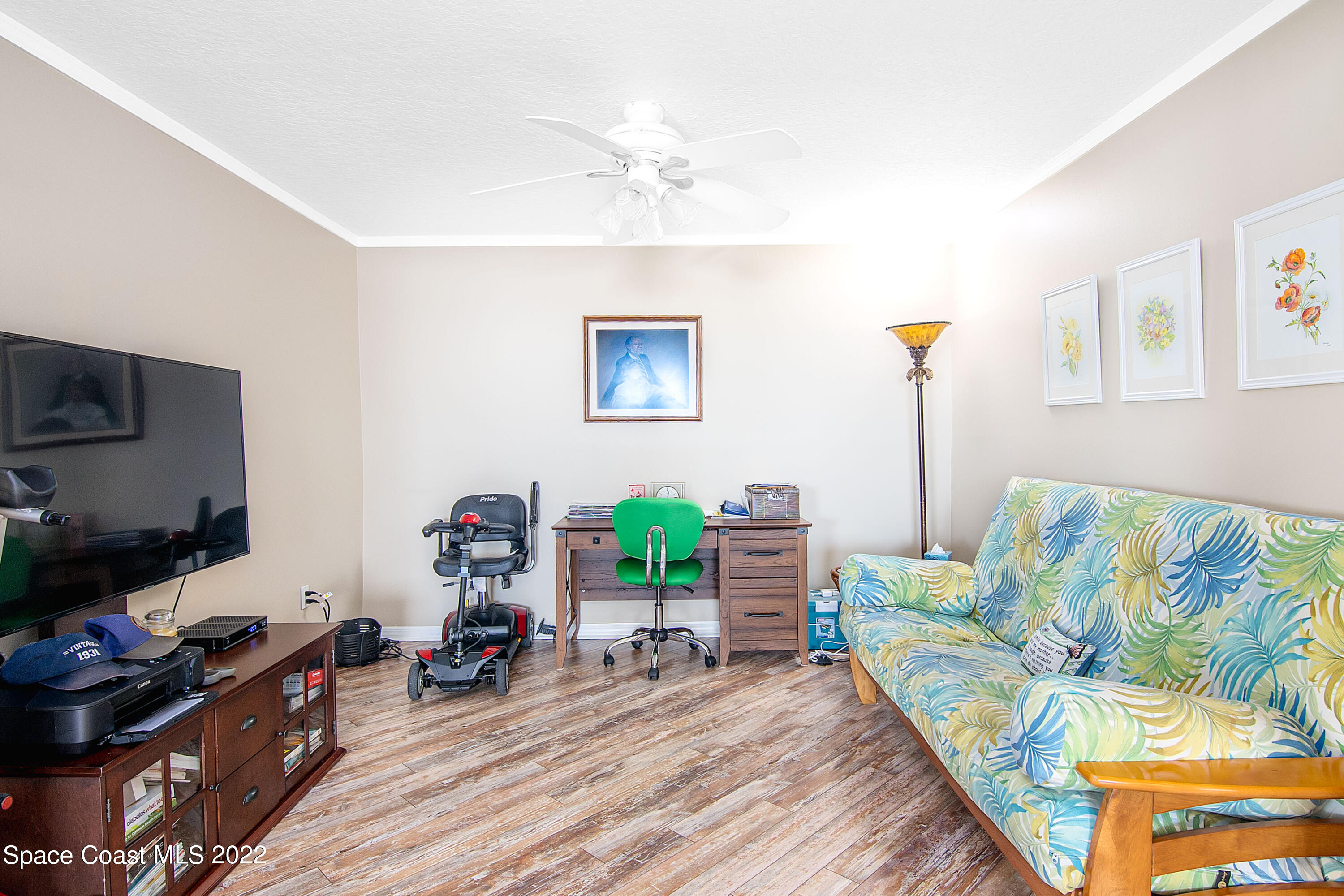 6770 Ridgewood Avenue, Unit 1001 Cocoa Beach, FL 32931 - Photo 37 of 57 a living room with furniture and a wooden floor
