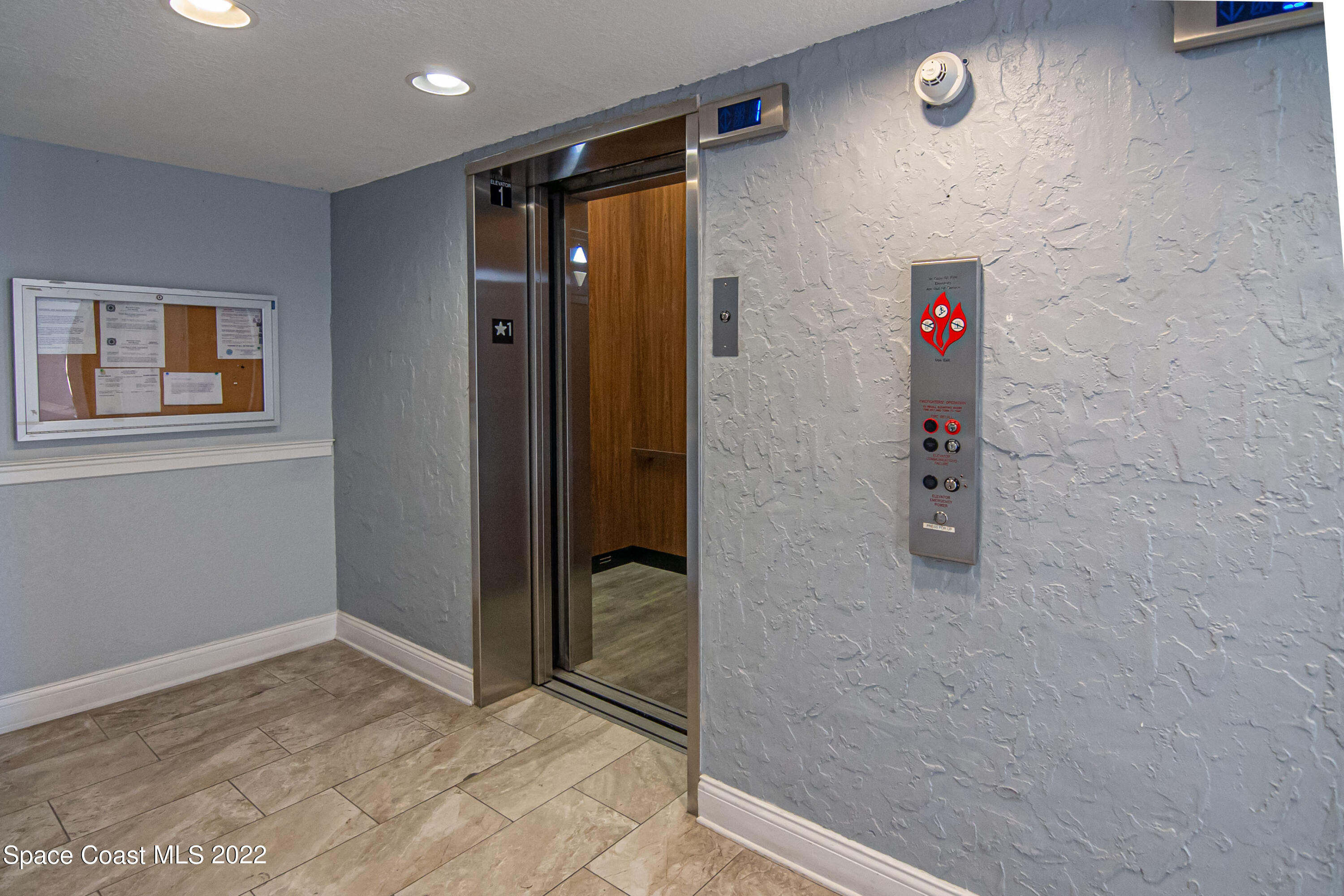 6770 Ridgewood Avenue, Unit 1001 Cocoa Beach, FL 32931 - Photo 41 of 57 an empty room with a door