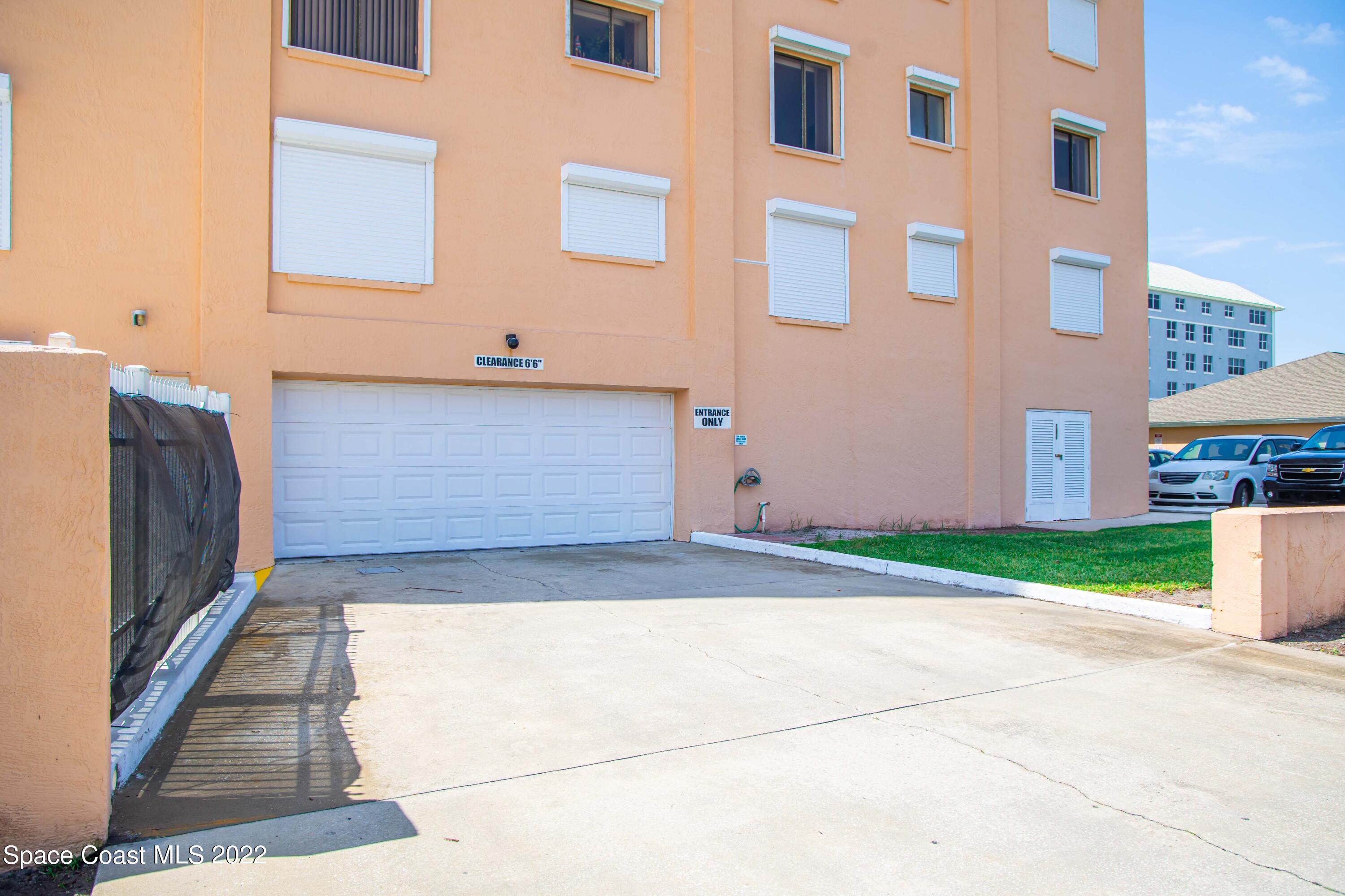 6770 Ridgewood Avenue, Unit 1001 Cocoa Beach, FL 32931 - Photo 45 of 57 a view of entrance gate of a house