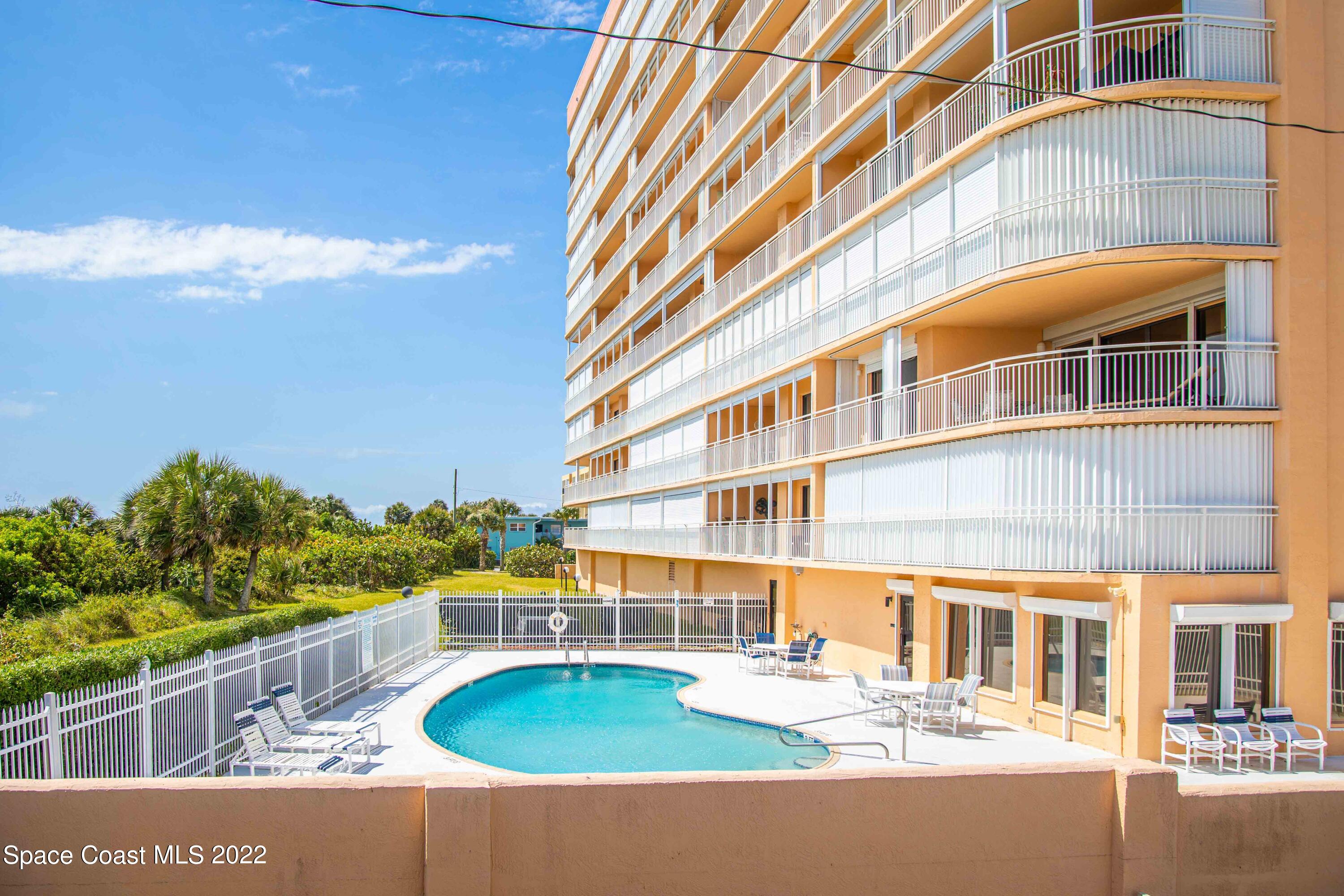 6770 Ridgewood Avenue, Unit 1001 Cocoa Beach, FL 32931 - Photo 55 of 57 a front view of a building