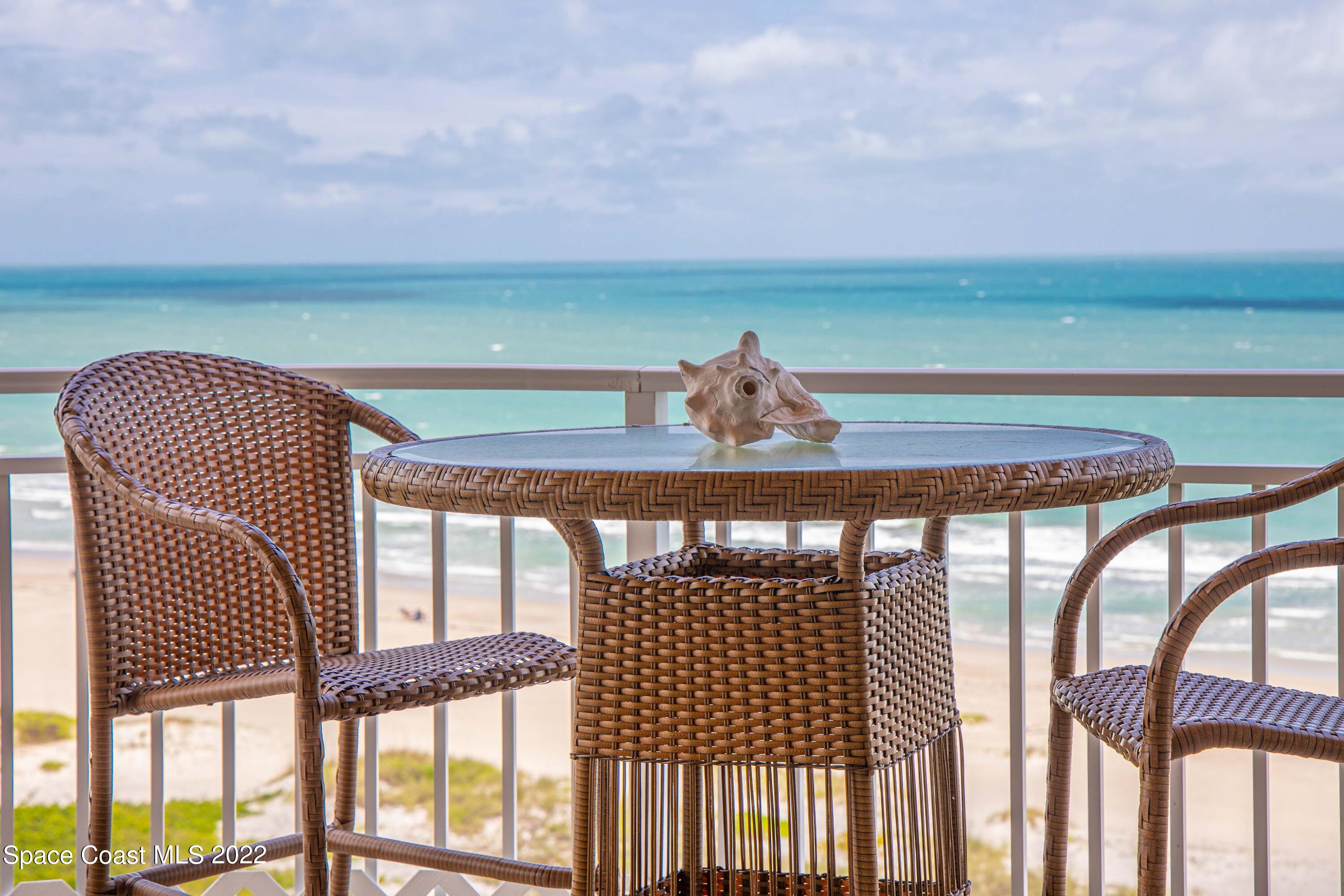 6770 Ridgewood Avenue, Unit 1001 Cocoa Beach, FL 32931 - Photo 8 of 57 CS Balcony East View Table