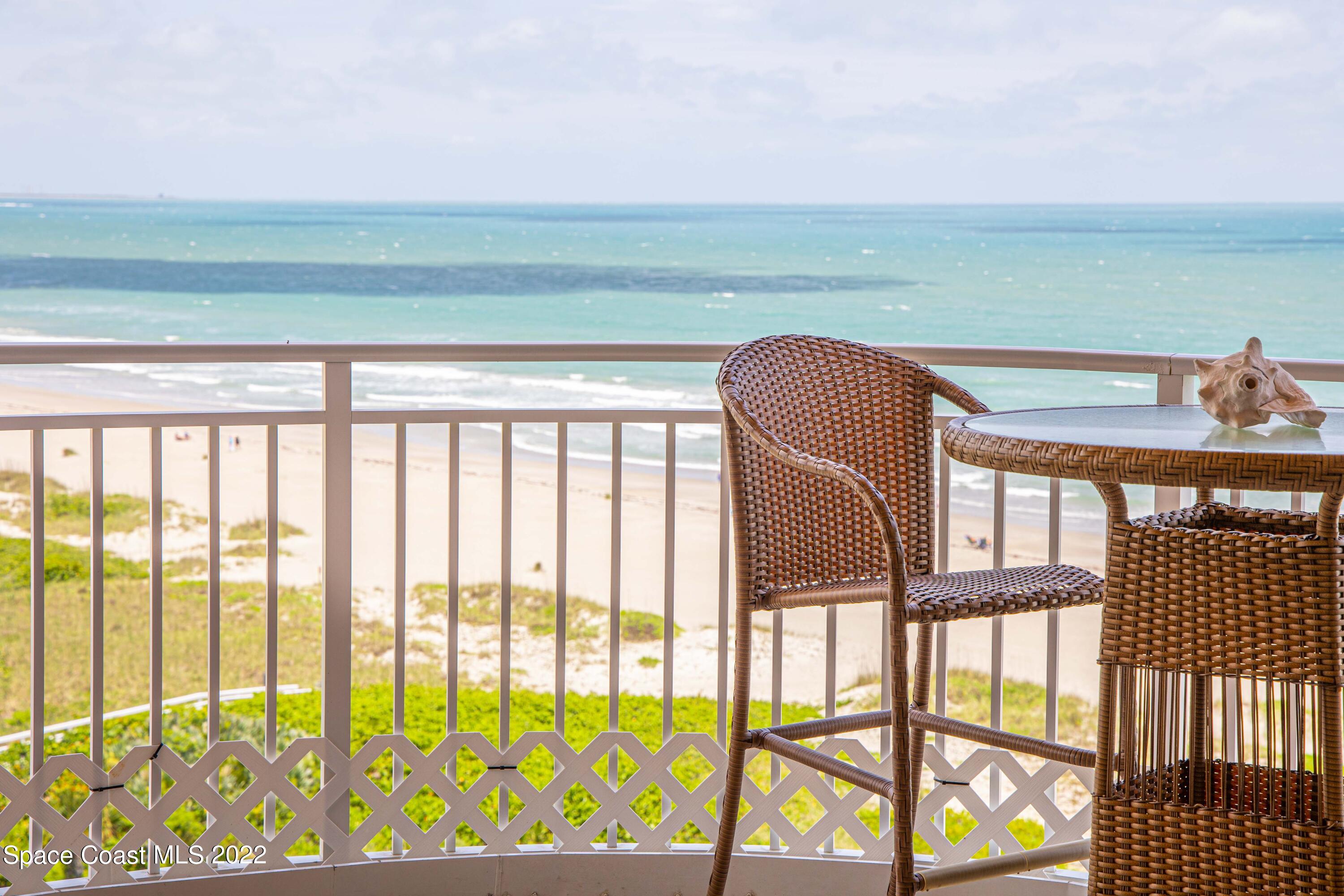 6770 Ridgewood Avenue, Unit 1001 Cocoa Beach, FL 32931 - Photo 9 of 57 a view of a balcony with an ocean view