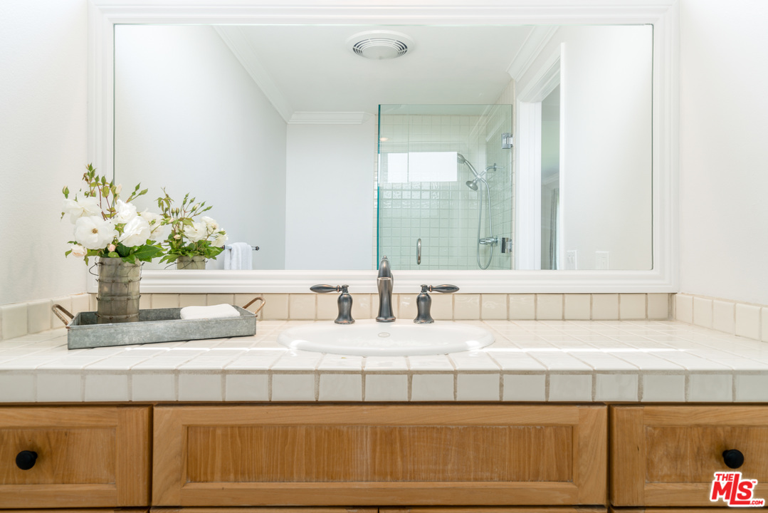 6267 Tapia Drive Malibu, CA 90265 - Photo 9 of 16 a bathroom with a sink and a mirror