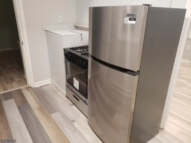 a view of a storage and utility room with washer and dryer