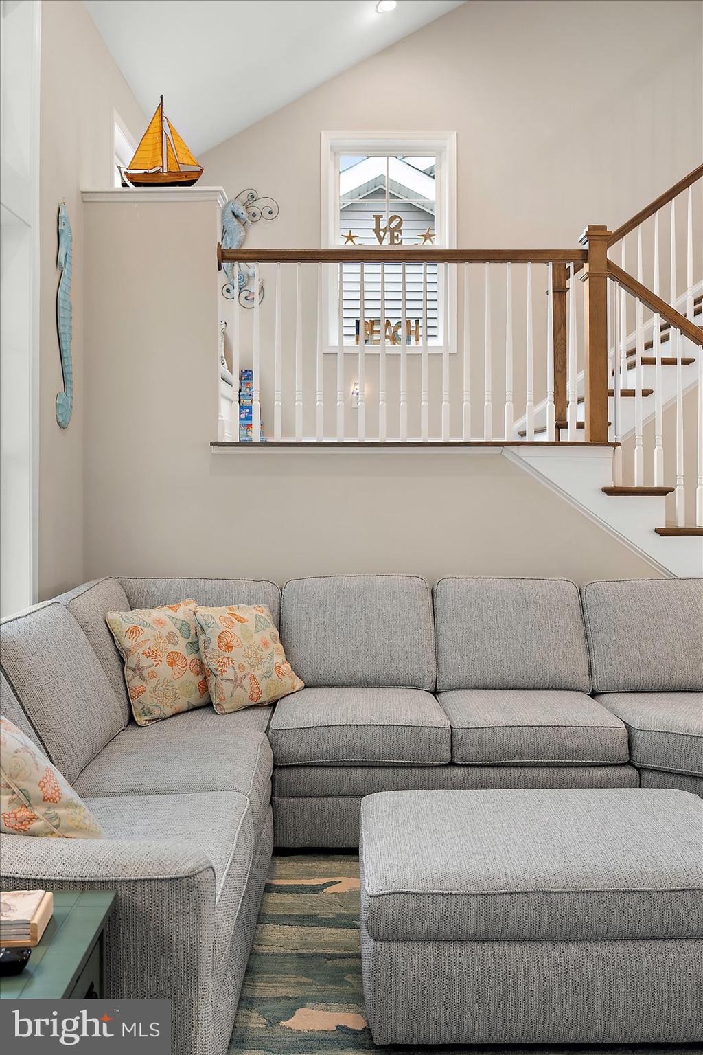 11271 Hall Road Lewes, DE 19958 - Photo 46 of 134 a living room with furniture and a painting on the wall