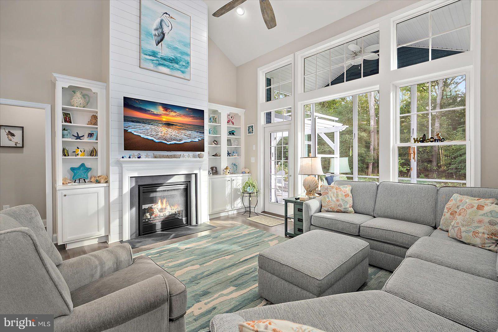 11271 Hall Road Lewes, DE 19958 - Photo 5 of 134 a living room with furniture a fireplace and a flat screen tv