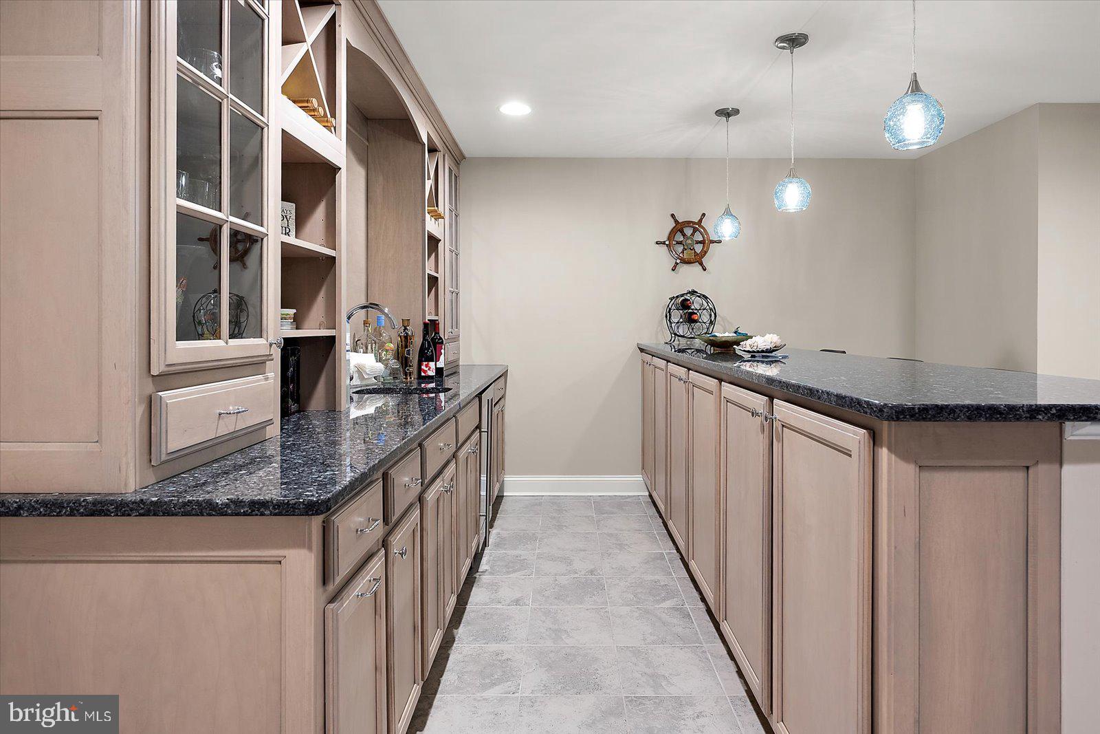 11271 Hall Road Lewes, DE 19958 - Photo 98 of 134 a kitchen with stainless steel appliances granite countertop a sink and a refrigerator