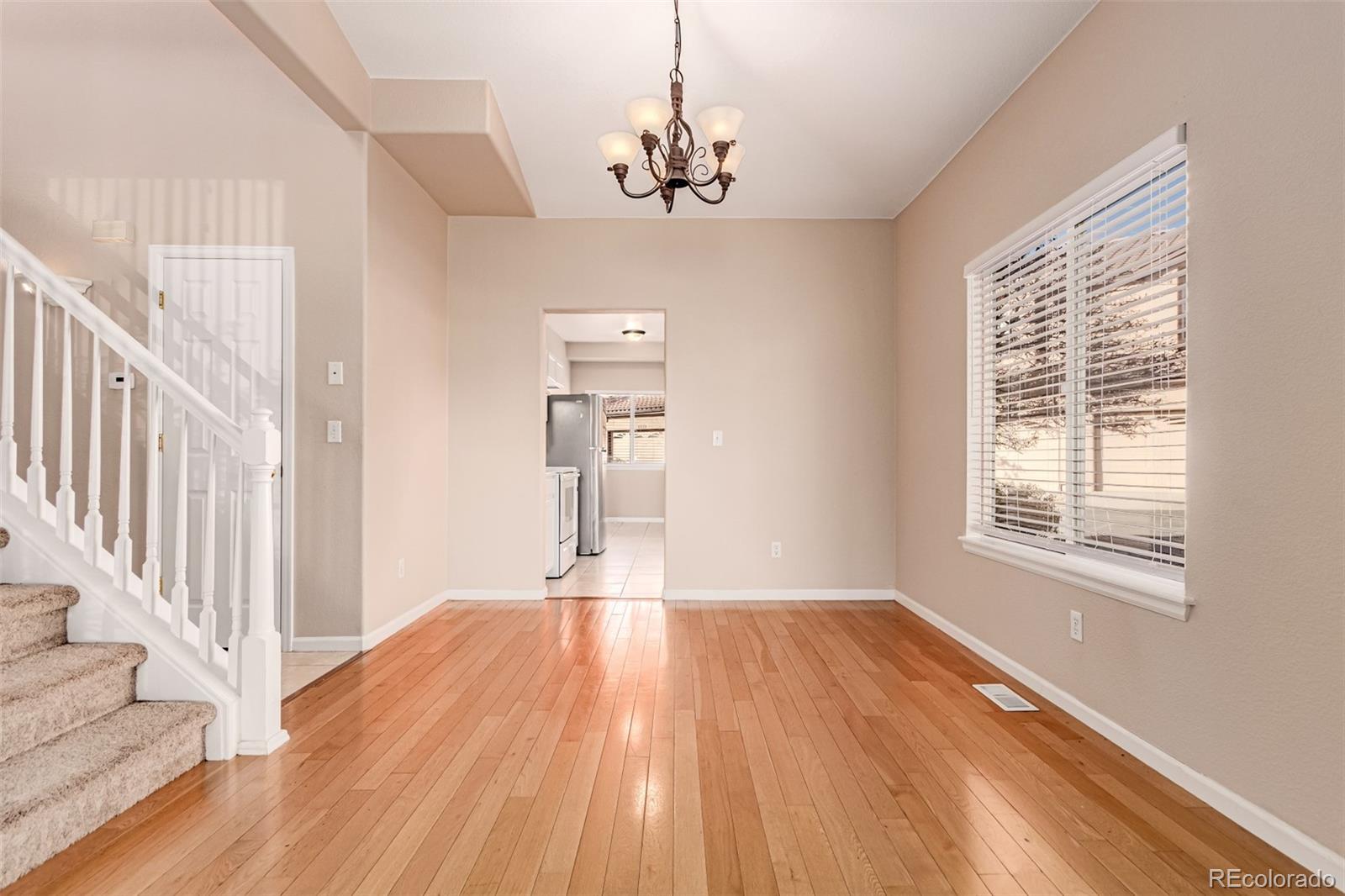 4538 South Atchison Way Aurora, CO 80015 - Photo 13 of 50 a view of empty room with wooden floor and fan