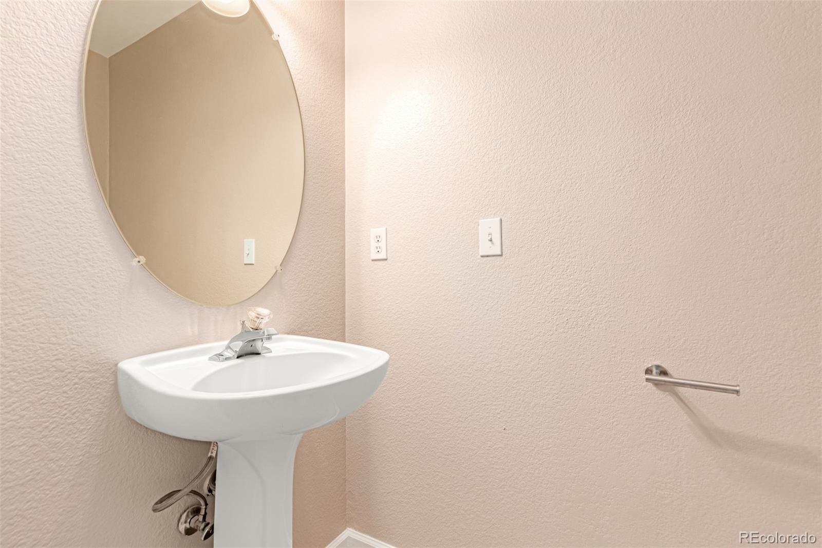 4538 South Atchison Way Aurora, CO 80015 - Photo 22 of 50 a bathroom with a sink and a mirror