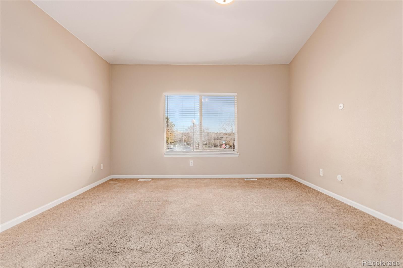 4538 South Atchison Way Aurora, CO 80015 - Photo 26 of 50 a view of an empty room with a window