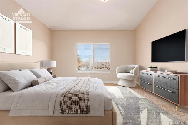 a bedroom with a bed and a flat screen tv