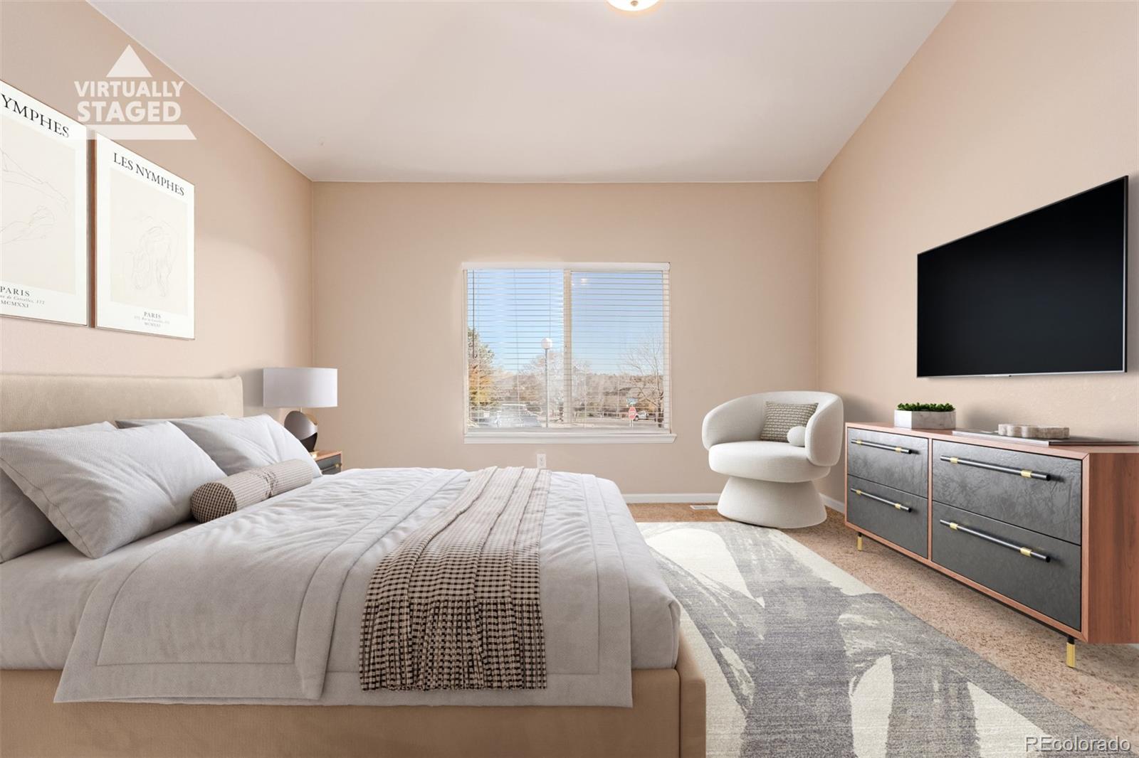 4538 South Atchison Way Aurora, CO 80015 - Photo 3 of 50 a bedroom with a bed and a flat screen tv