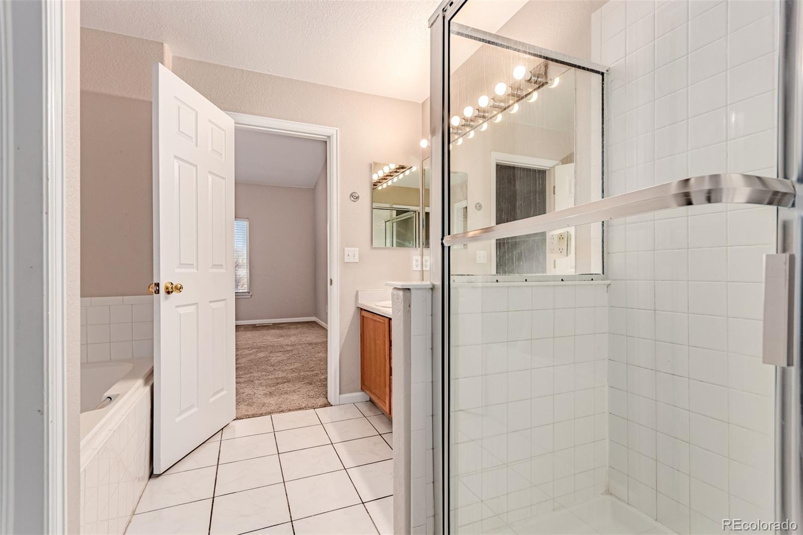 4538 South Atchison Way Aurora, CO 80015 - Photo 32 of 50 a bathroom with a sink and a mirror