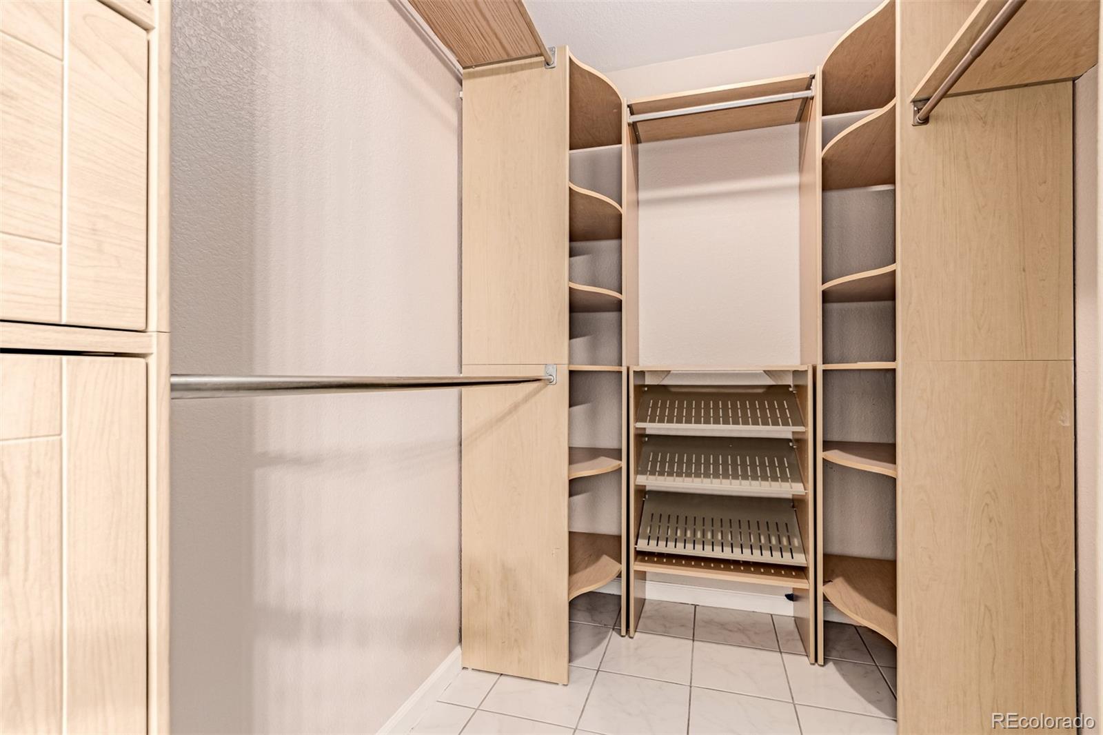 4538 South Atchison Way Aurora, CO 80015 - Photo 33 of 50 a view of walk in closet with empty racks