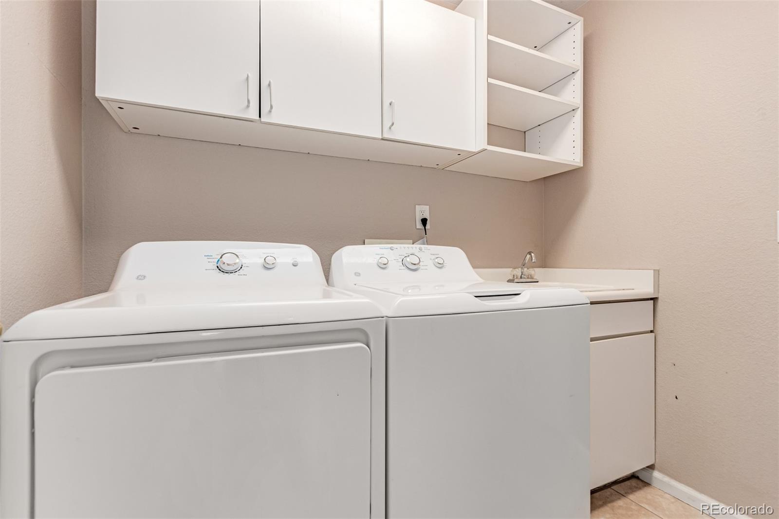 4538 South Atchison Way Aurora, CO 80015 - Photo 48 of 50 a utility room with dryer and washer