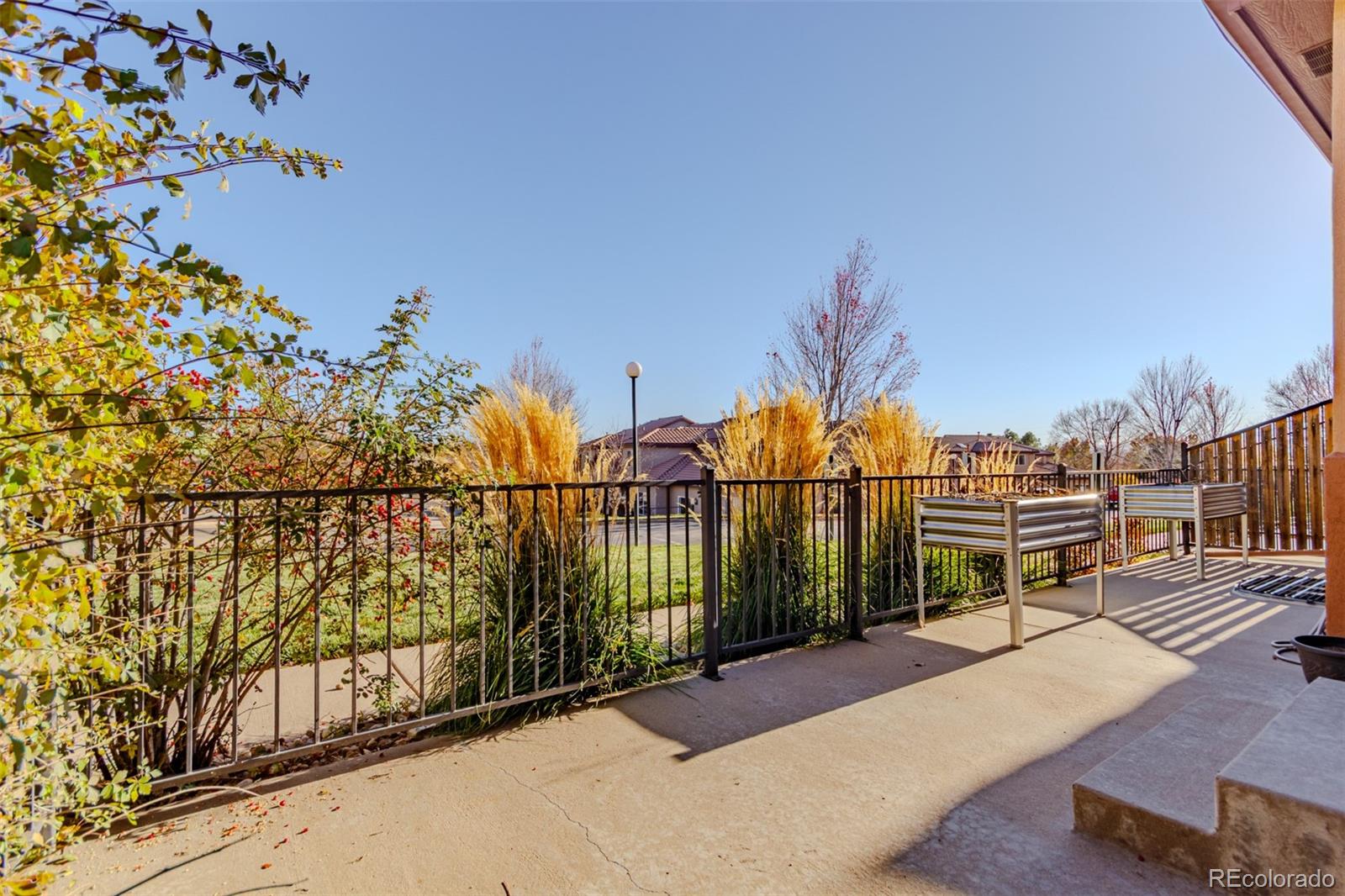 4538 South Atchison Way Aurora, CO 80015 - Photo 50 of 50 a view of a balcony with wooden fence
