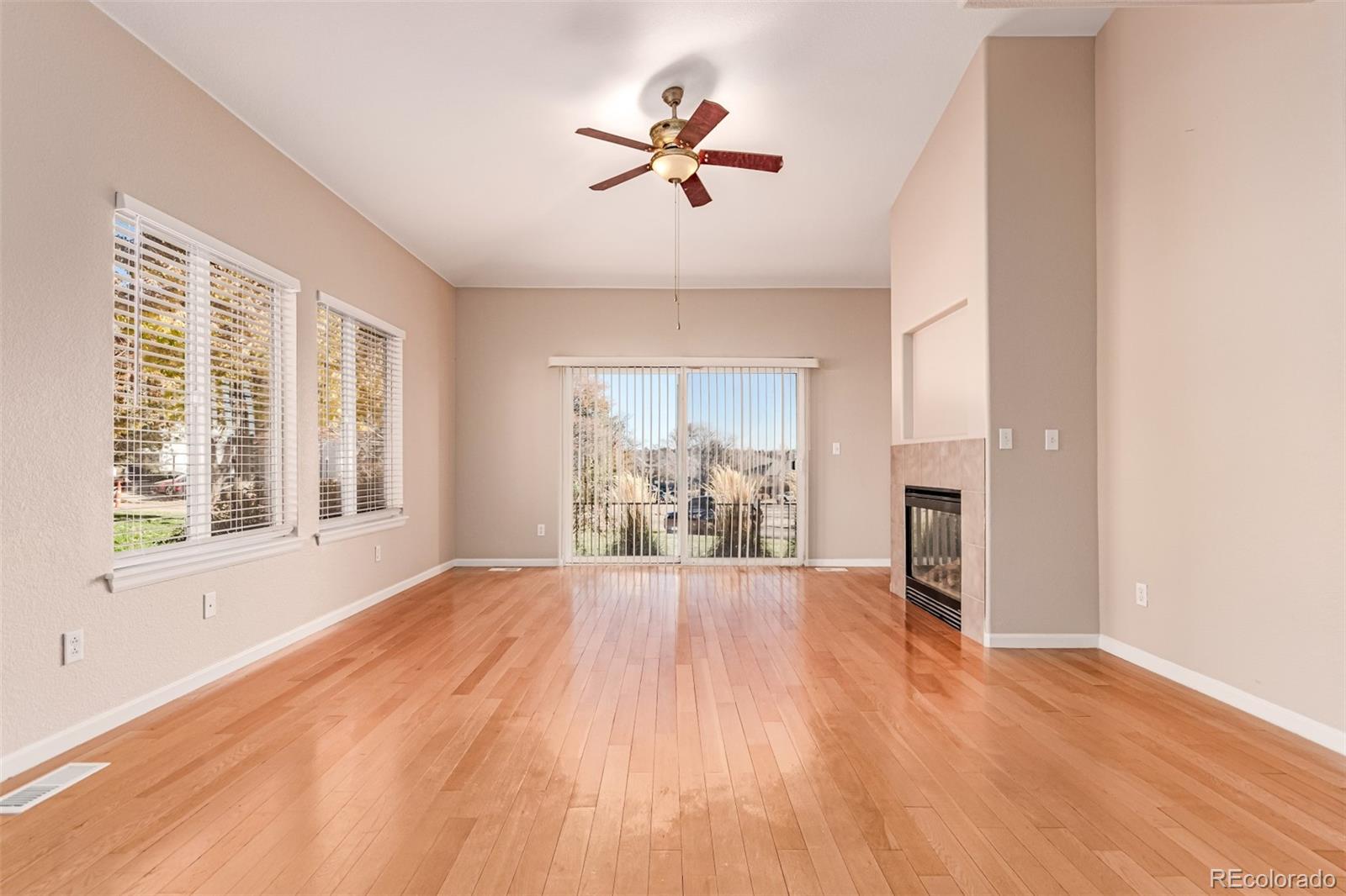 4538 South Atchison Way Aurora, CO 80015 - Photo 8 of 50 wooden floor in an empty room with a window