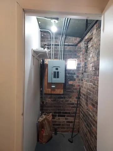 a bathroom with a mirror and a shower