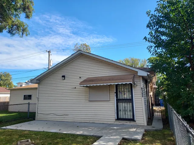 a front view of a house with a garage