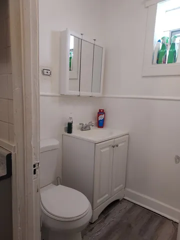a bathroom with a toilet and a sink