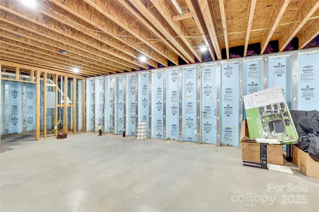 a view of an empty room with wooden walls